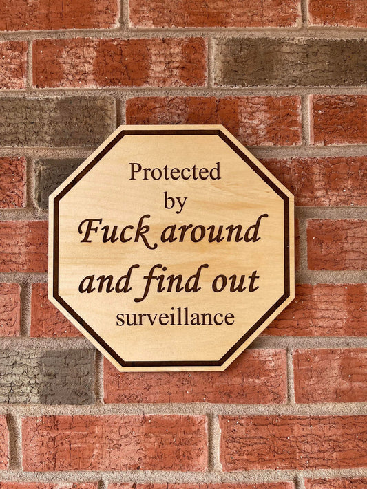 Humorous Home Security Sign - Deter Intruders with Wit and Style - Protected by Fuck around and find out surveillance